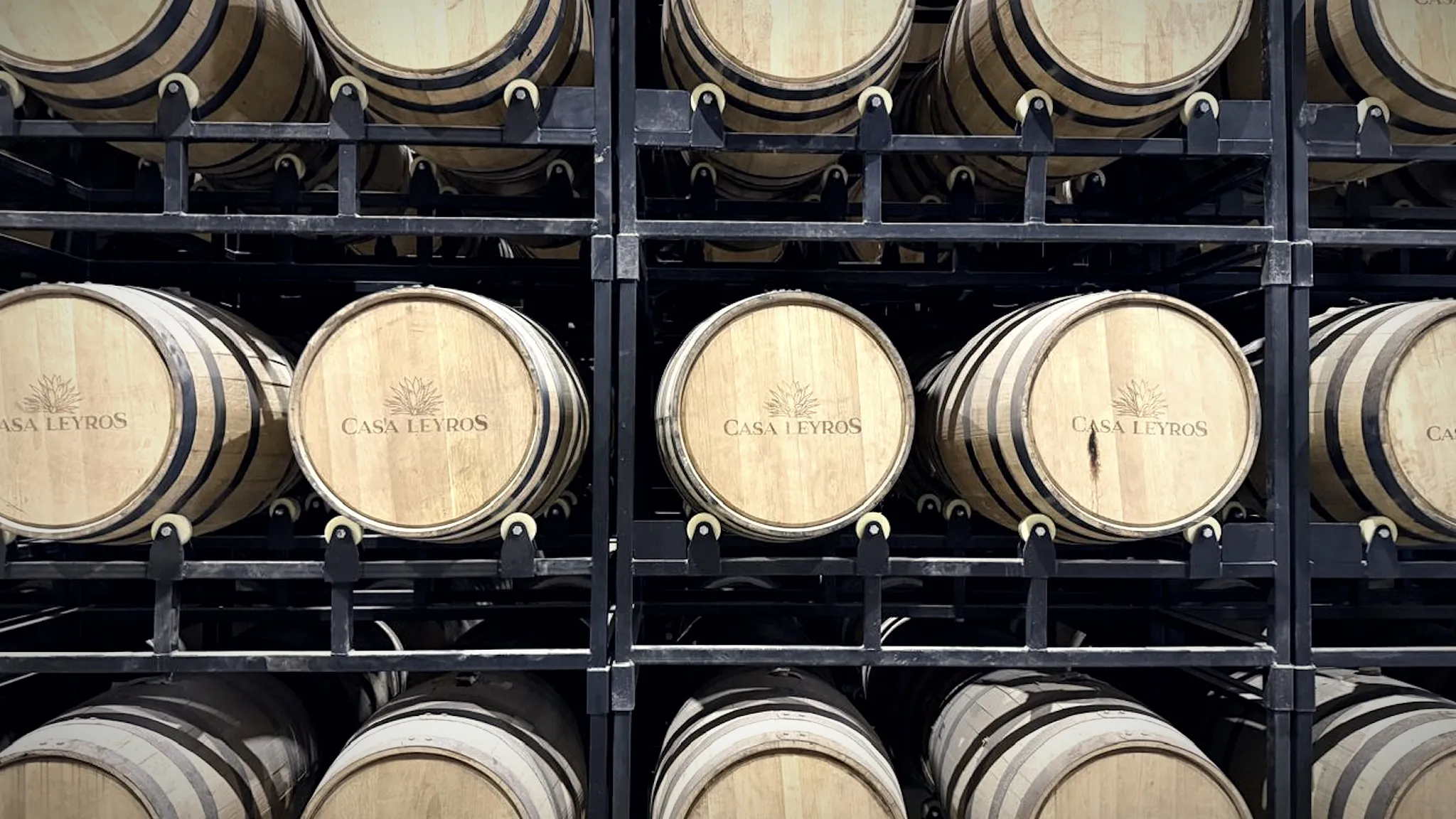 American oak barrels resting in the maturation warehouse