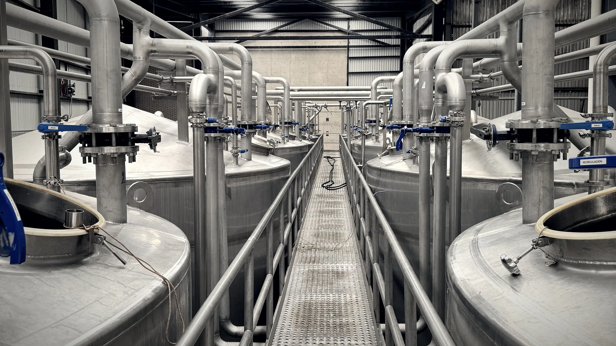 Stainless steel fermentation tanks at the distillery